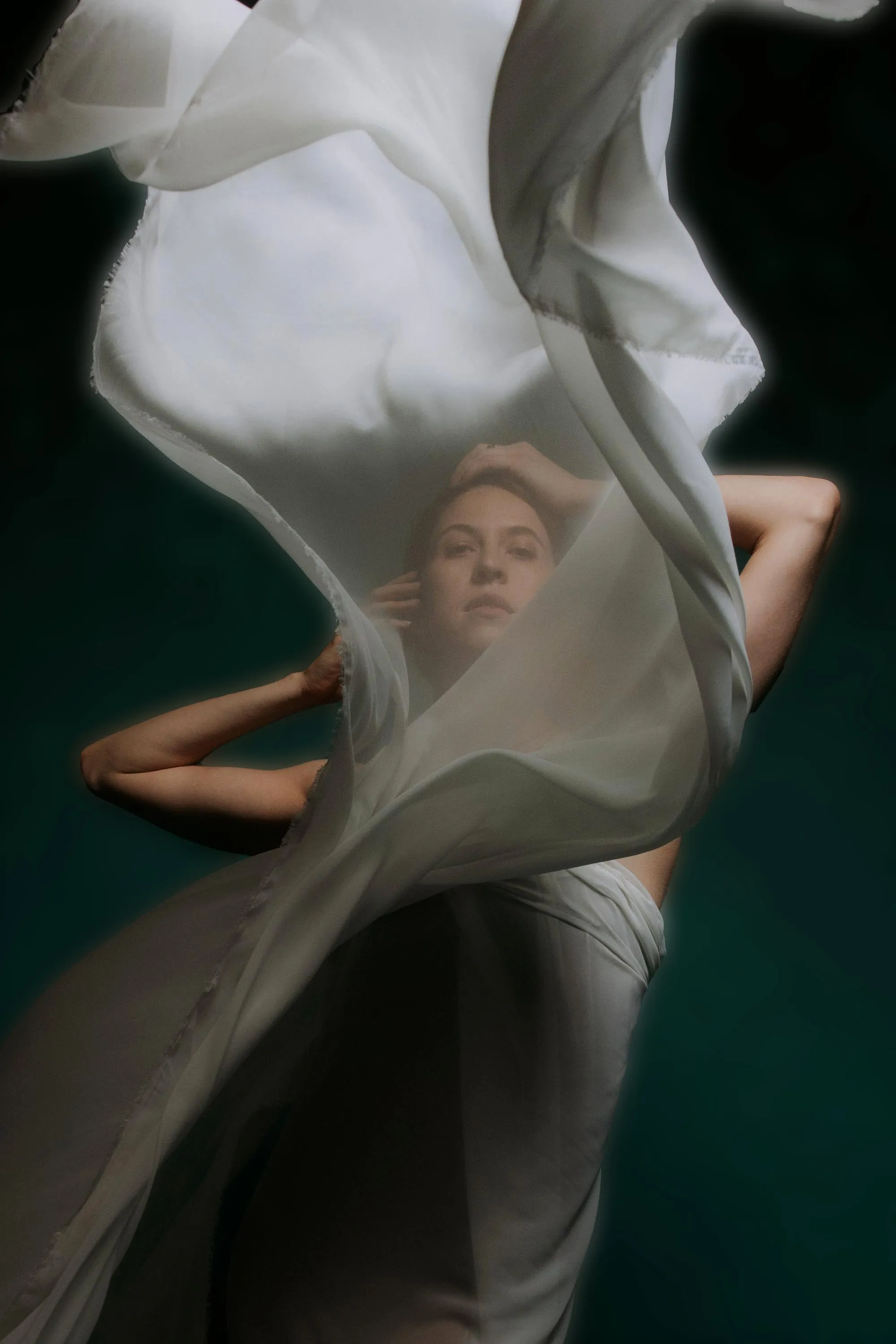 Alex Schooling seen through a veil of white silk